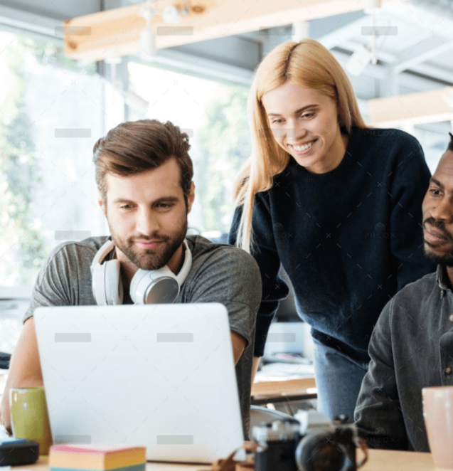 happy-colleagues-sitting-in-office-coworking-PHYA6TG-2000x1125